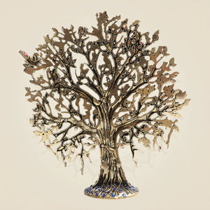 Decorative metal tree wall art on a beige background