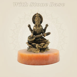 Bronze Chaturbhuja Saraswati Idol on Lotus on yellow stone