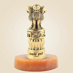 Gold-colored emblem with lion design on a beige background