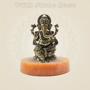 Ornate Brass Ganesha Idol 4" on stone
