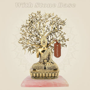 Brass buddha on stone base