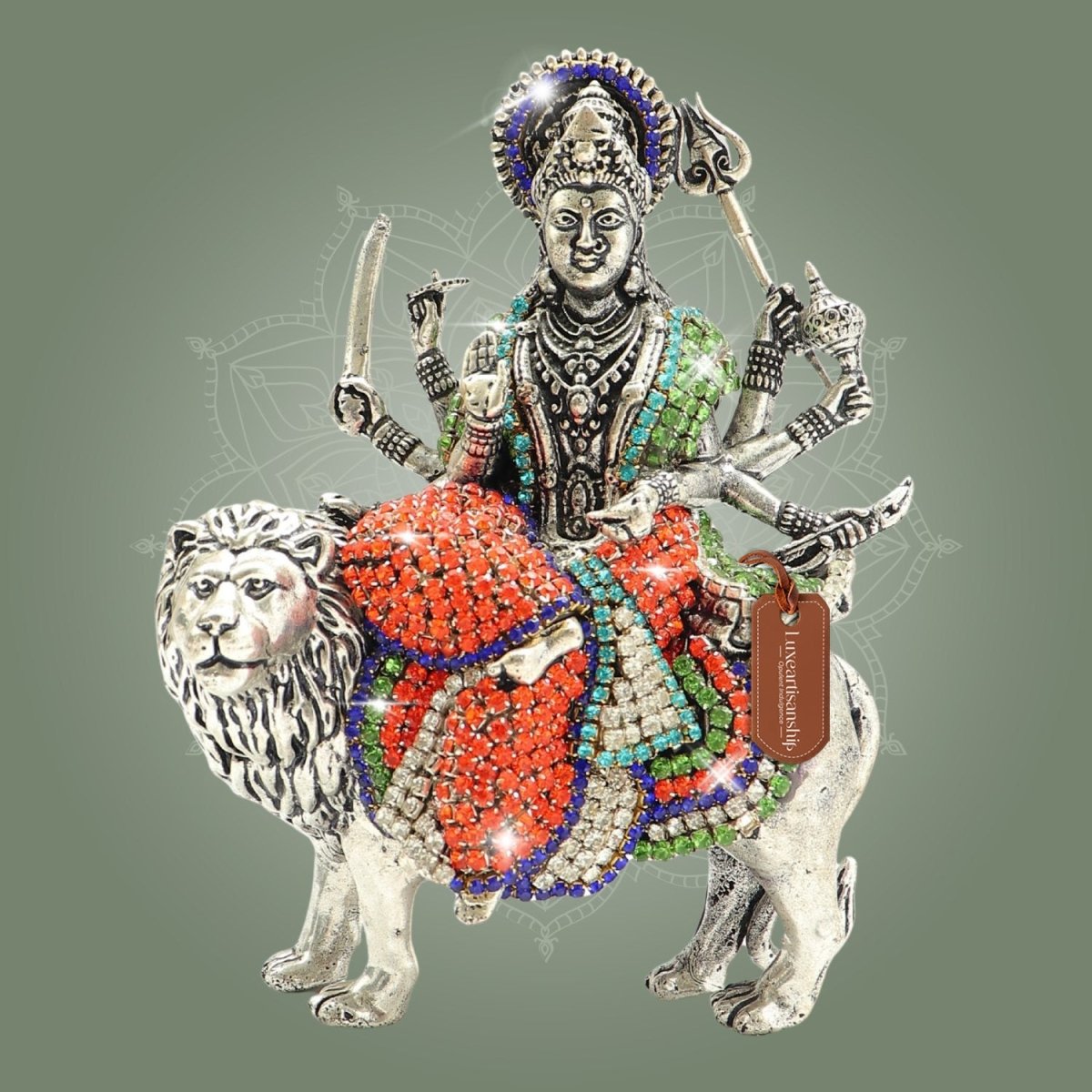 Decorative figurine of a deity on a lion with colorful embellishments