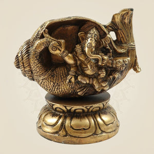 Divine Brass Ganesh Sitting in Shankh on Peacock Design Idol