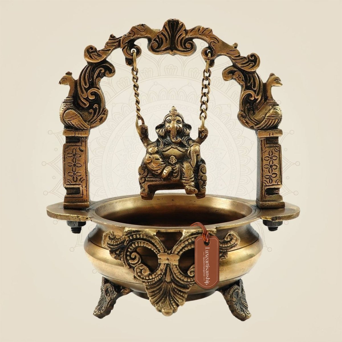 Elegant Brass Ganesh Idol on Jula Swing with Urli