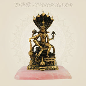 Lord Vishnu murti with stone base