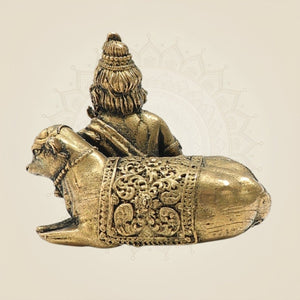 1.5" Bronze Bal Krishna Resting with Cow – Vintage Look Spiritual Showpiece - Luxeartisanship
