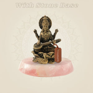Bronze Chaturbhuja Saraswati Idol on Lotus on pink stone