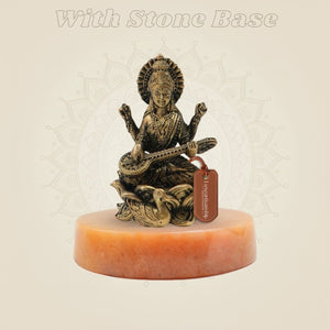Bronze Chaturbhuja Saraswati Idol on Lotus on yellow stone