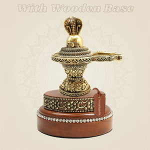 Brass Shiva Lingam 5" Featuring Naag Canopy with Round Wooden Base - Luxeartisanship