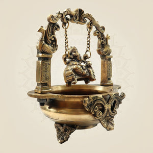 Elegant Brass Ganesh Murti on Jula Swing