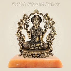 Goddess Laxmi statue on stone base