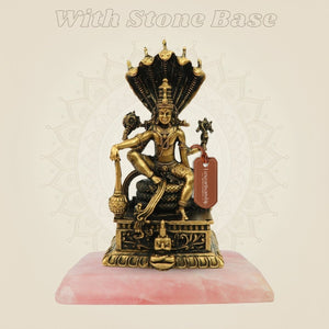 Lord Vishnu murti with stone base