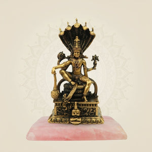 Lord Vishnu murti with stone base