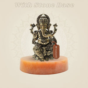 Ornate Brass Ganesha Idol 4" on stone