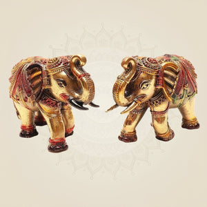 4" brass elephant pair. Trunk-up design