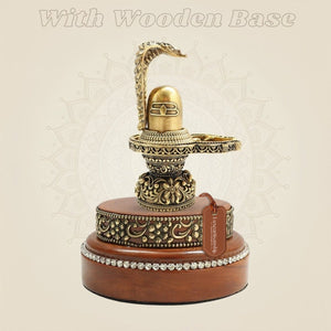Traditional Brass Shiva Lingam with Naag Canopy on Wooden Base 4.25" - Luxeartisanship